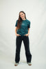 Model trägt Mission One More ‚Touched by Grace‘ T-Shirt fair & nachhaltig produziert